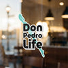 Don Pedro Life sticker with stylized turquoise graphic and copyright text.