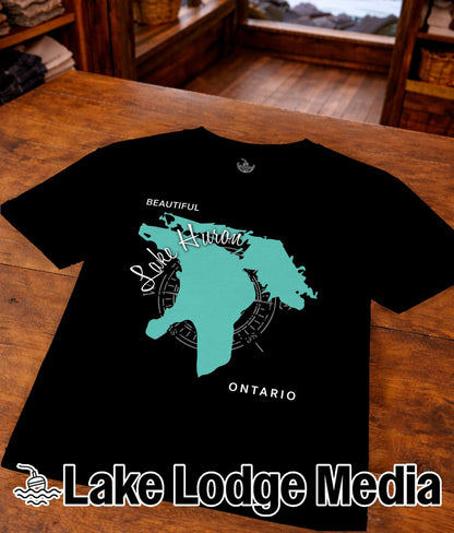 Black t-shirt featuring a teal outline map of Lake Huron with compass and text.