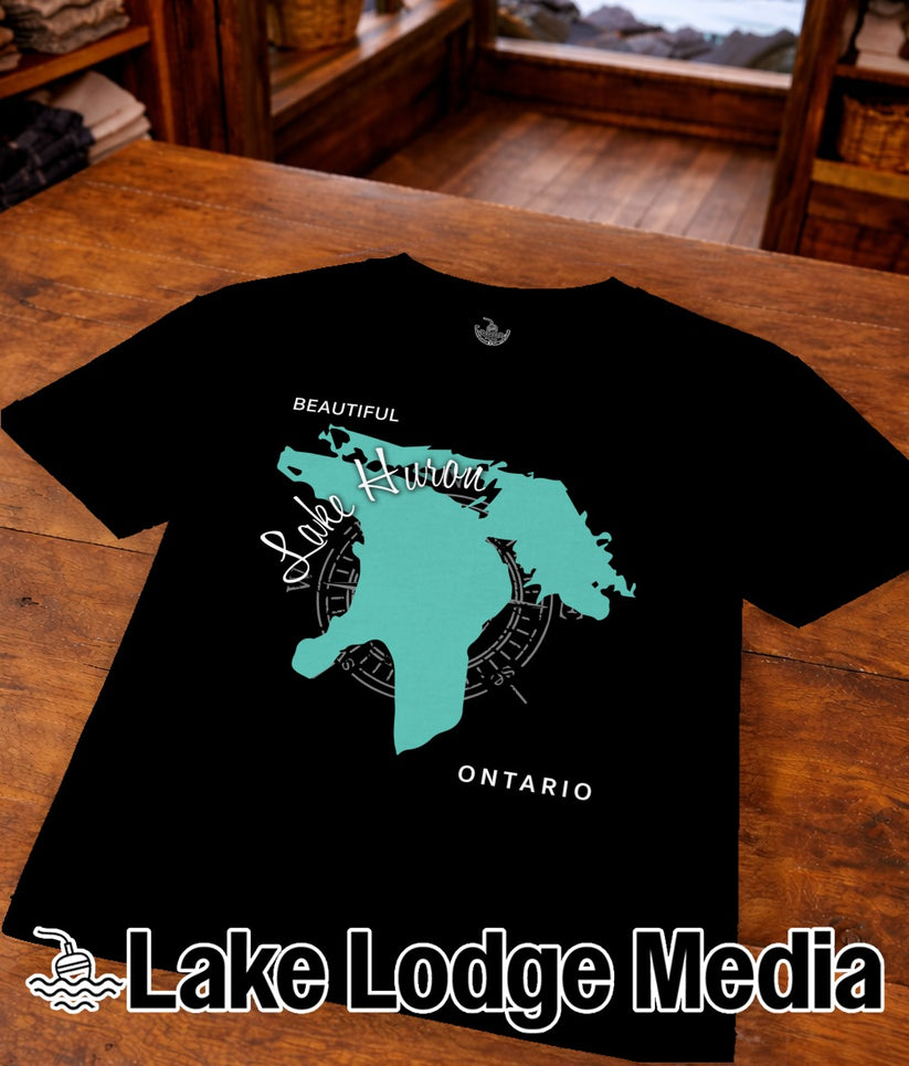 Black t-shirt featuring a teal outline map of Lake Huron with compass and text.