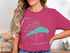 Kinwah Island compass rose design on a pink t-shirt.