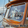Stonewall Jackson Life sticker on a wooden boat with Lake Lodge Media text.