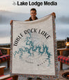 Man holding a Table Rock Lake, Missouri map blanket with compass design.