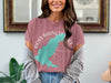 Pink t-shirt with a teal map outline of Ross Barnett Lake, Mississippi, and compass graphic.