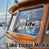 Wooden boat cabin with "Hemlock Life" and "Lake Lodge Media" text.