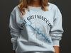 Light blue sweatshirt with Lake Greenwood South Carolina map and compass design.