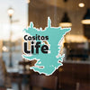 Casitas Life sticker with black text on a teal, lake-shaped background.
