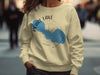 Light yellow sweatshirt with Pearl Lake Wisconsin map and compass design.
