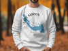 White sweatshirt with blue Lake Marion outline, compass, and text.