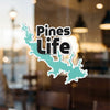 Sticker with turquoise lake outline and text "Pines Life".
