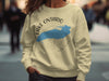 Light yellow sweatshirt with Lake Ontario map and compass design.