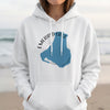 White hoodie featuring a blue silhouette of Emerald Lake, Canada with compass graphic.