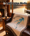 Tapestry blanket with "BELEWS LAKE NORTH CAROLINA" and a compass rose map.