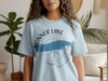 Light blue t-shirt with Donner Lake California graphics and a compass rose design.