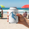 White can cooler with blue Newfound Lake map and compass on a beach.