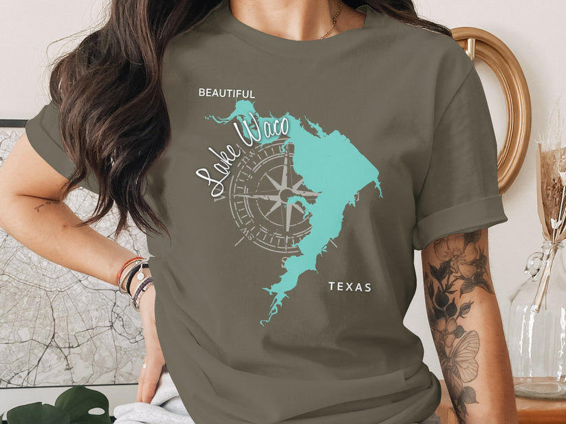 T-shirt featuring a teal outline of Lake Waco, Texas, with a compass rose.