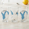 Three clear glasses with blue Lake Union map and compass designs.