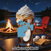 Glass of iced coffee with whipped cream, s'mores ingredients, campfire, and lake at night.