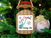 Sled ornament with "Merry Christmas from Great Sacandaga Lake" text hangs on tree.