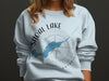 Sweatshirt with Shoal Lake, Ontario map and compass graphic.