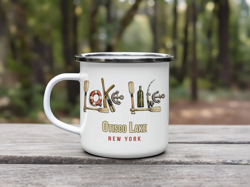 White enamel mug with "Otisco Lake" text and nautical graphics.