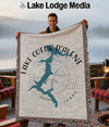 Man holds a blanket with a Lake Coeur d'Alene map and Idaho text.