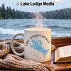 White mug with Lake Winnipesaukee map and compass graphic on a rainy day.