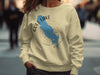 Yellow sweatshirt with blue Gull Lake, Michigan map and compass design.