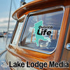 Quivira Life sticker on a boat window, with Lake Lodge Media logo.