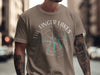 Taupe t-shirt with "The Finger Lakes New York" text and compass graphic.