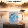White mug with "Floyd Lake Minnesota" map design on a lake background.