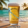 Glass of beer with "Lake Havasu Arizona" text and compass on a beach.