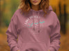Dusty rose hoodie with Lake Hickory Carolina compass graphic and text.