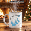 White mug with Reelfoot Lake map and compass design, steaming coffee splashes.