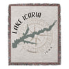 Woven blanket with "Lake Icara Iowa" text, lake shape, and compass rose design.