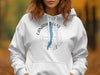 White hoodie with Canadic Lake New York compass graphic and blue lake outline.