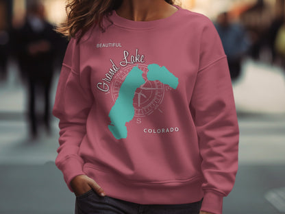Pink sweatshirt with teal Grand Lake Colorado map and compass design.