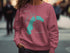 Pink sweatshirt with teal Grand Lake Colorado map and compass design.