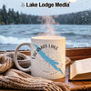 White mug with "Lacamas Lake Washington" text and blue lake graphic on a rainy window background.
