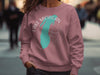 Rose sweatshirt with turquoise Michigan shape and compass graphic.