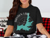 Black t-shirt with Hayden Lake, Idaho map and compass graphic.