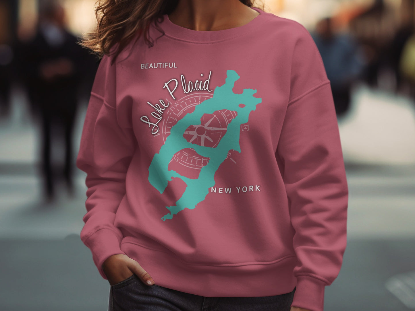 Maroon sweatshirt with teal "Lake Placid" text and compass rose graphic.