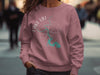 Pink sweatshirt with Lake LBJ Texas map and compass design.