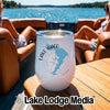 A white travel tumbler with a blue map of Lake Waco and a compass design sits on a boat table.