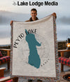 Woven throw blanket with a teal Peyto Lake map design and "Lake Lodge Media" text.