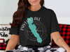 Black t-shirt with Pavlas Lake, Wisconsin design and compass rose.