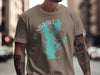 Taupe t-shirt with turquoise Rend Lake map and compass design, "ILLINOIS" text.