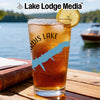 Glass of iced tea with lake map design, lemon slice, and Lake Lodge Media logo.