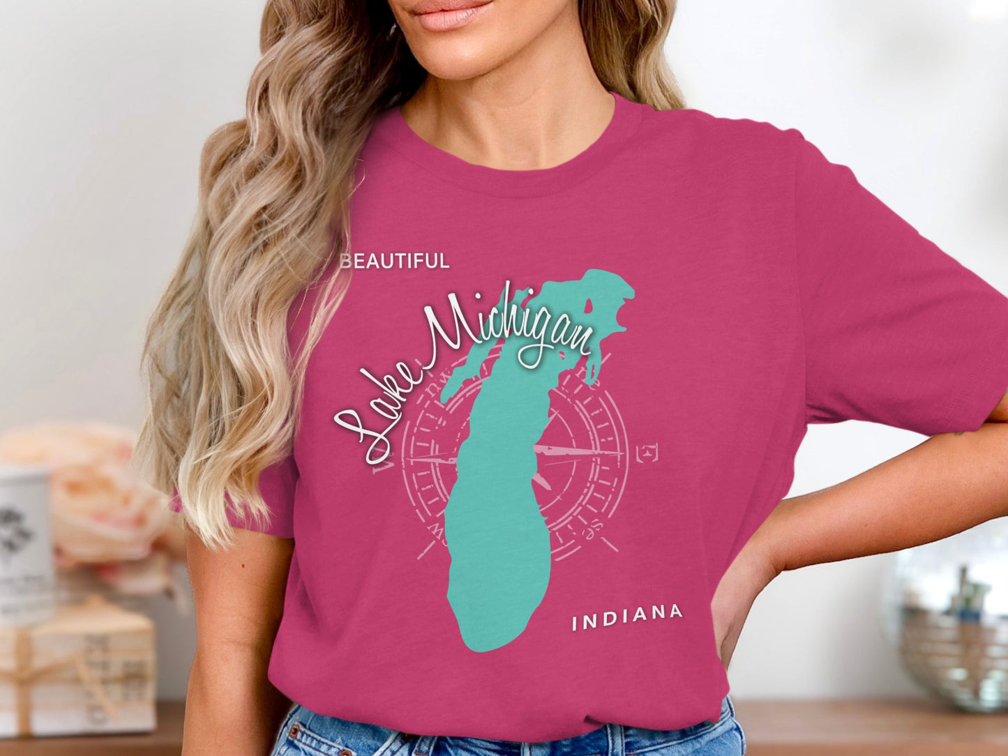 Pink t-shirt with "Lake Michigan" and compass graphic in teal.