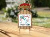 Wooden sled ornament with "Merry Christmas from Madison Lakes" text.