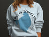 Light blue sweatshirt with Lake Okeechobee Florida map graphic and text.